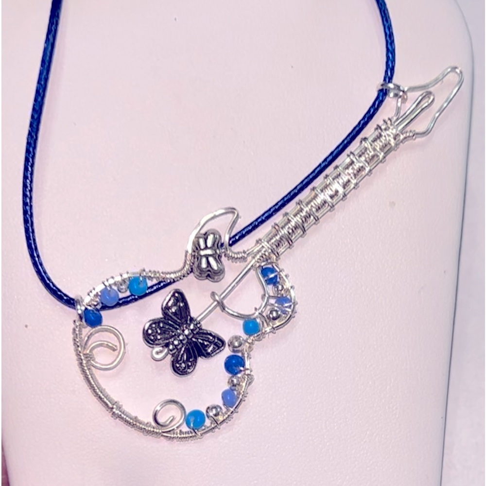 Wire wrapped silver guitar